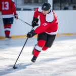 Professional ice hockey player in attack on the rink.